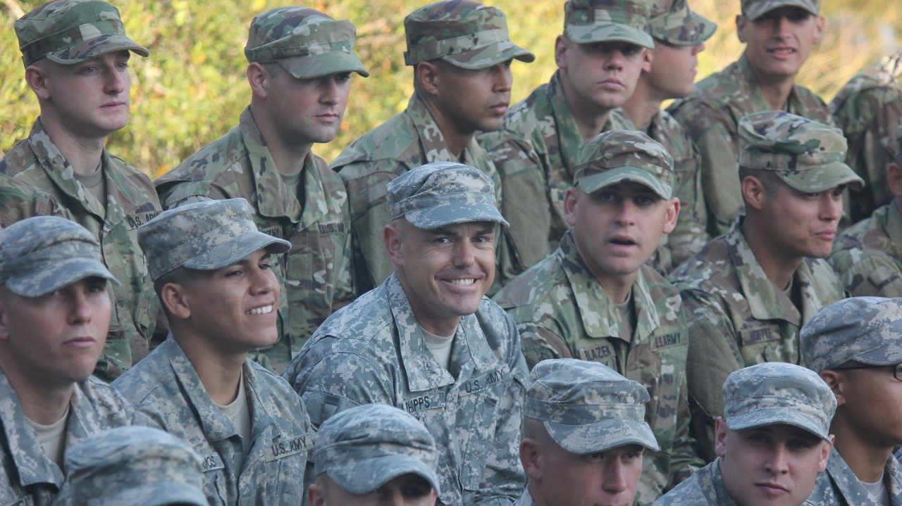 Uniformed Men posing for a picture